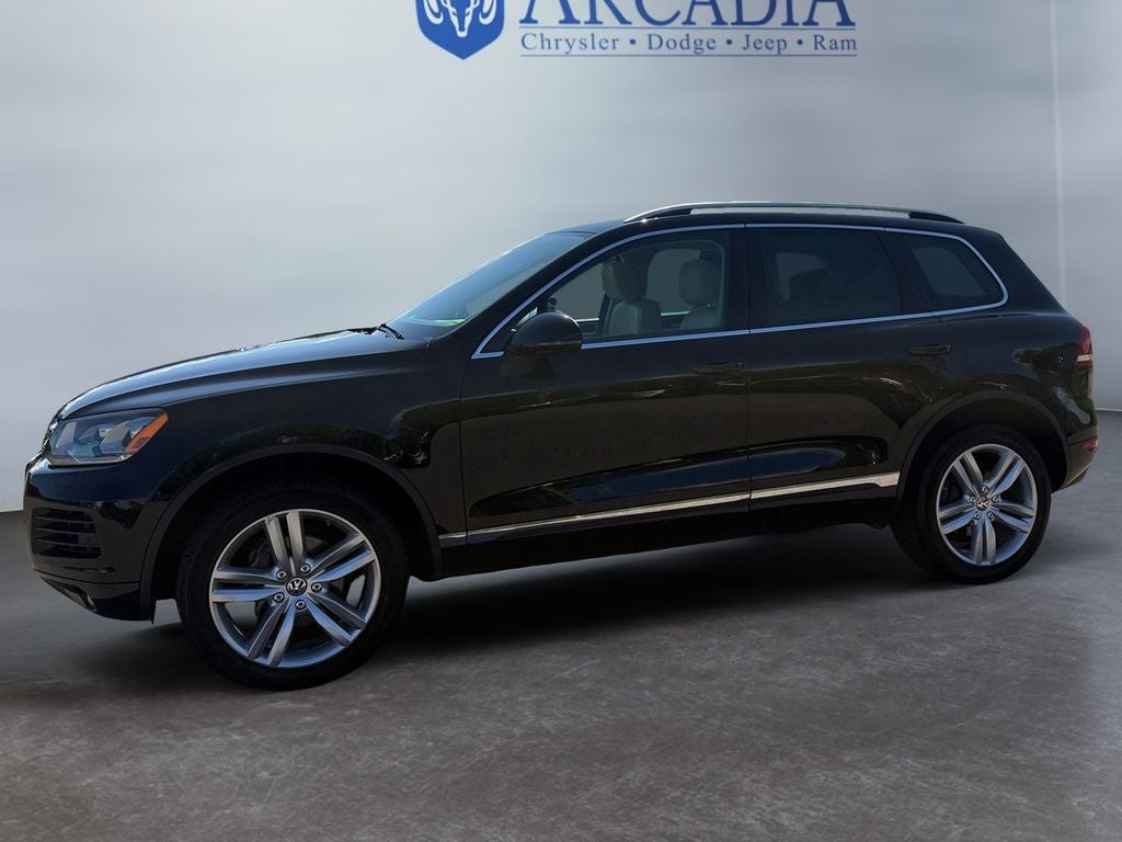 Used 2014 Volkswagen Touareg Sport with VIN WVGEF9BP2ED002119 for sale in Arcadia, WI
